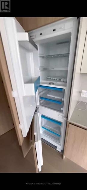 Toronto (Church-Yonge Corridor) condo for rent - A white refrigerator with its door open is shown.
