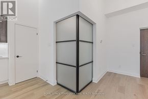 Toronto (Waterfront Communities) condo for rent - A room with a white door and a wooden floor.