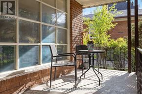 Toronto (Willowdale East) apartment for rent - A patio with a table and chairs is shown.