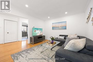 Toronto (Willowdale East) apartment for rent - A living room with a grey couch and a painting on the wall.