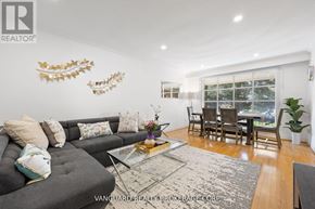 Toronto (Willowdale East) apartment for rent - A living room with a grey couch and a glass coffee table.