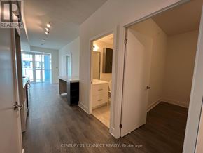 Toronto (Don Valley Village) condo for rent - A real estate listing photo of a bedroom with a desk and a closet.