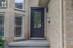 London East (East I) apartment for rent - A kitchen with wooden cabinets and a stainless steel refrigerator.