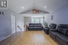 London East (East I) apartment for rent - A wooden deck with chairs and a table is surrounded by a fence and trees.