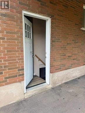 Welland (N. Welland) apartment for rent - A white door is open to a dark interior.