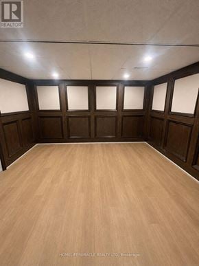 Welland (N. Welland) apartment for rent - A room with wooden floors and walls, and a ceiling with recessed lighting.