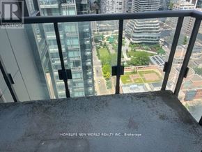 Toronto (Bay Street Corridor) condo for rent - A view from a high-rise building looking down at a cityscape.