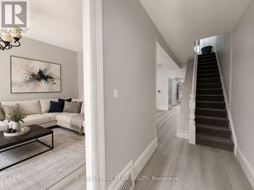 Ottawa duplex for rent - A living room with a couch, coffee table, and a painting on the wall.