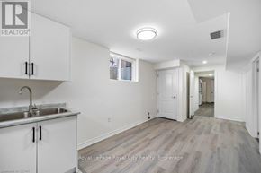 Guelph (Grange Road) apartment for rent - A kitchen area with white cabinets and a sink.
