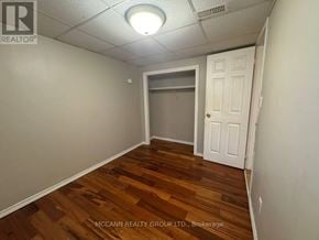 Toronto (Brookhaven-Amesbury) apartment for rent - A room with wooden flooring and a white door.
