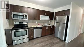 Toronto (Bendale) condo for rent - A kitchen with a stove top oven, microwave, refrigerator, and dishwasher.
