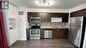 Toronto (Bendale) condo for rent - A kitchen with a refrigerator, oven, and sink.