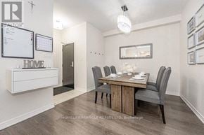 Oakville (Ro River Oaks) townhouse for rent - A dining room with a wooden table and chairs.