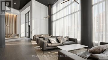 Mississauga (City Centre) condo for rent - A modern living room with a long couch and a coffee table.