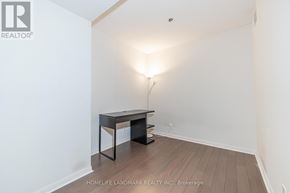Toronto (Bay Street Corridor) condo for rent - A room with a desk and a lamp.