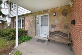 Markham (Grandview) apartment for rent - A bench is placed on a concrete slab in front of a house.