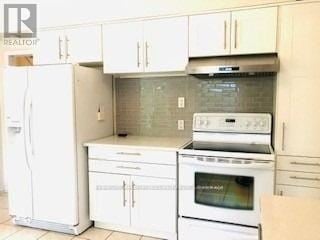 Markham (Grandview) apartment for rent - A white fridge and oven in a kitchen.