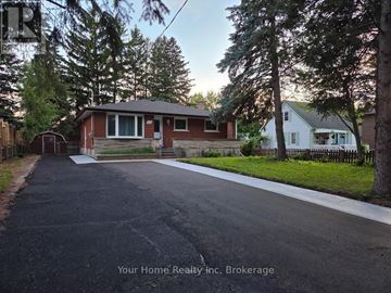 Kitchener apartment for rent - A house with a driveway in front of it is shown in the image.