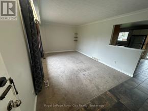 Guelph (Victoria North) apartment for rent - A room with a carpet floor and a window.