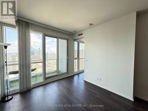 Toronto (Bay Street Corridor) condo for rent - A room with a large window and a view of the city.