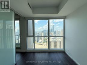 Toronto (Bay Street Corridor) condo for rent - A room with a view of the city skyline.