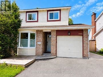 Ottawa apartment for rent - A two-story house with a garage is for sale.