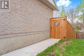 Guelph (Kortright Hills) apartment for rent - A wooden gate with a diamond pattern in the middle is closed.
