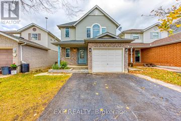 Cambridge apartment for rent - A house with a grey garage door is for sale.