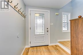 Cambridge apartment for rent - A white door with a glass window is in the middle of a room.