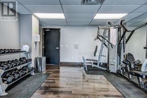 Toronto (Waterfront Communities) condo for rent - A gym with a variety of equipment including weights and cardio machines.
