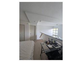 Surrey apartment for rent - A room with a desk and a bed.