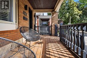 Toronto (East York) apartment for rent - A balcony with a chair and a railing.