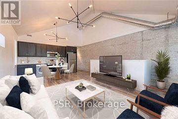 Toronto (The Beaches) multi-family for rent - A modern living room with a brick wall and a flat screen TV.