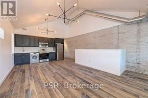 Toronto (The Beaches) multi-family for rent - A room with wooden floors and a brick wall is for sale.