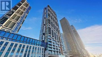 Vaughan (Concord) condo for rent - A group of modern high-rise buildings with glass facades.