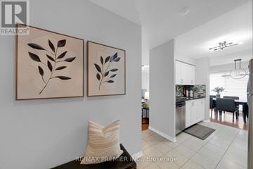 Richmond Hill (Langstaff) condo for rent - A living room with two leaf paintings on the wall.