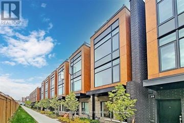 Brampton (Fletcher's Creek South) townhouse for rent - A row of modern townhouses with a clear blue sky above.