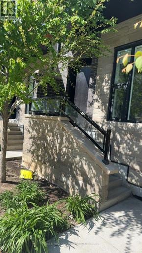 Brampton (Fletcher's Creek South) townhouse for rent - A tree is in front of a building with a window.