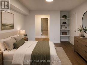 Toronto (Markland Wood) condo for rent - A bedroom with a bed, nightstand, and a painting on the wall.