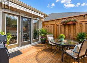 London North (North B) house for rent - A patio with a glass table and chairs is shown.