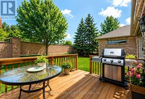 London North (North B) house for rent - A patio with a grill and a table with a plate on it.