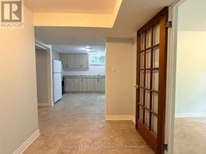 Niagara Falls (West Wood) apartment for rent - A room with a door leading to a kitchen area.
