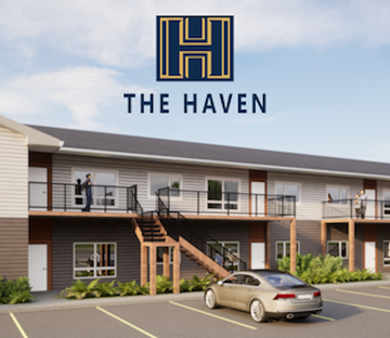 Stonewall apartment for rent - A car is parked in a parking lot in front of a building with a sign that says "The Haven.".
