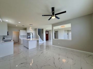 Ewa Beach apartment for rent - A spacious kitchen with marble flooring and a ceiling fan.