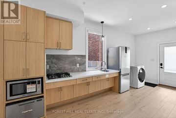 North York apartment for rent - A kitchen with wooden cabinets and a modern design.