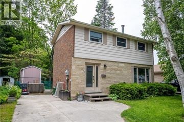 Owen Sound apartment for rent - A house with a grey roof and a brown door.