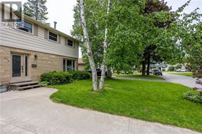 Owen Sound apartment for rent - A house with a tree in front of it.