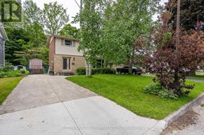 Owen Sound apartment for rent - A house with a driveway in front of it.
