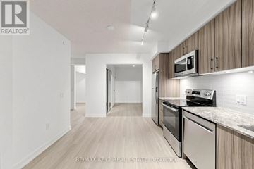 Toronto (Humber Heights) condo for rent - A modern kitchen with wooden cabinets and stainless steel appliances.