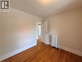 Hamilton apartment for rent - A room with a white wall and a white radiator.